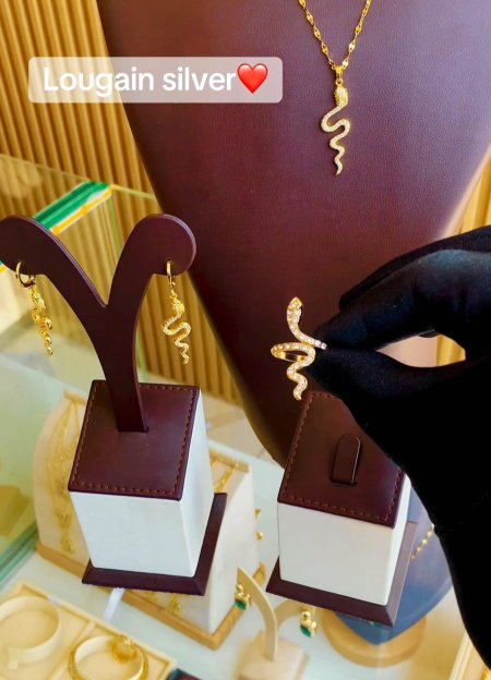 طقم الحيه المطلي بالذهب ( عقد وخاتم وحلق )